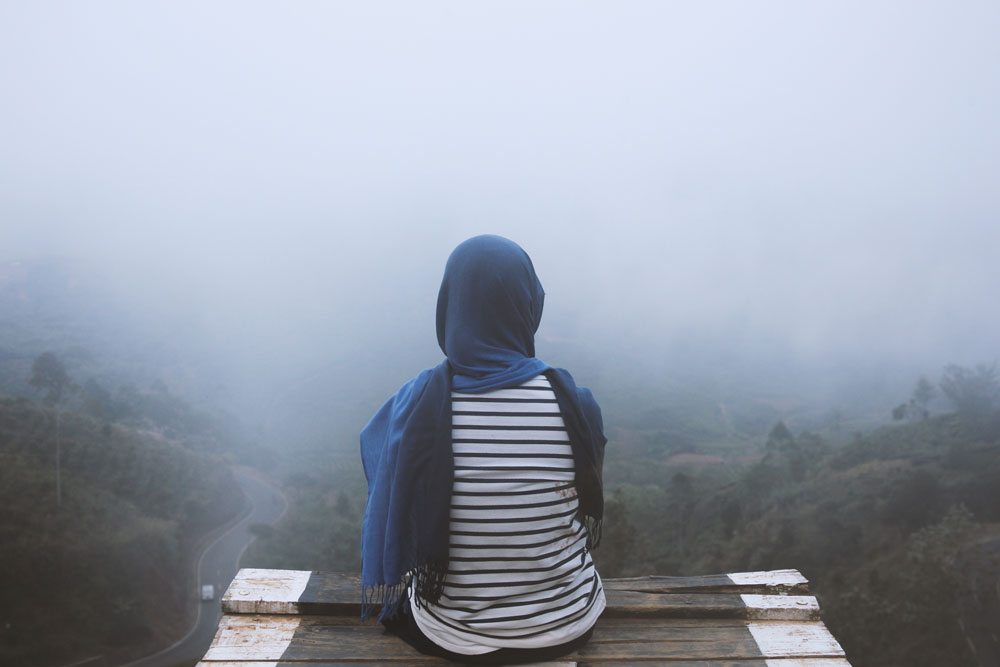 A silhouette emerging from fog